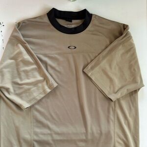 Oakley tan and black shirt size M features a back pocket
